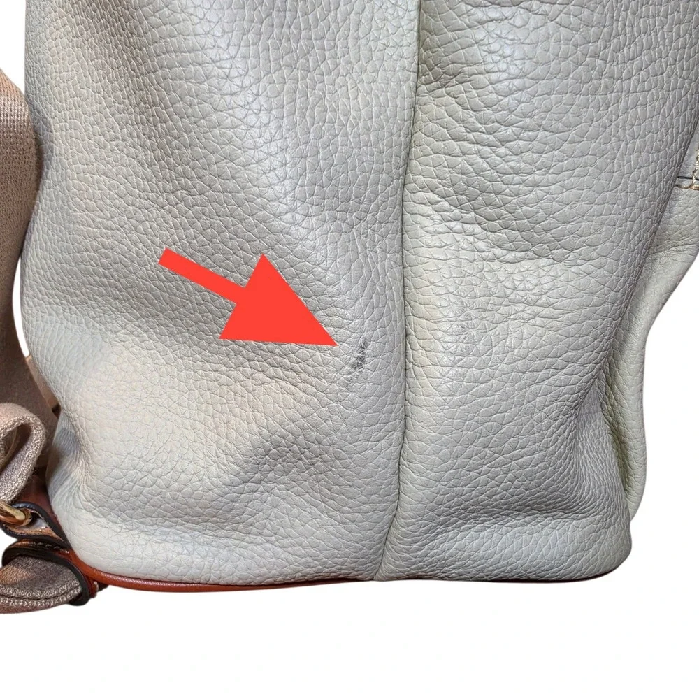 Dooney & Bourke Pebbled Leather Drawstring Backpack White Tan Tassel Logo